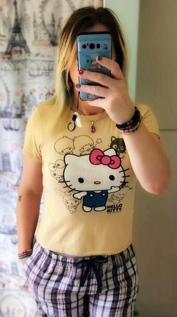 Alice, standing in jammy pants and a cute, light blonde Hello Kitty tee.